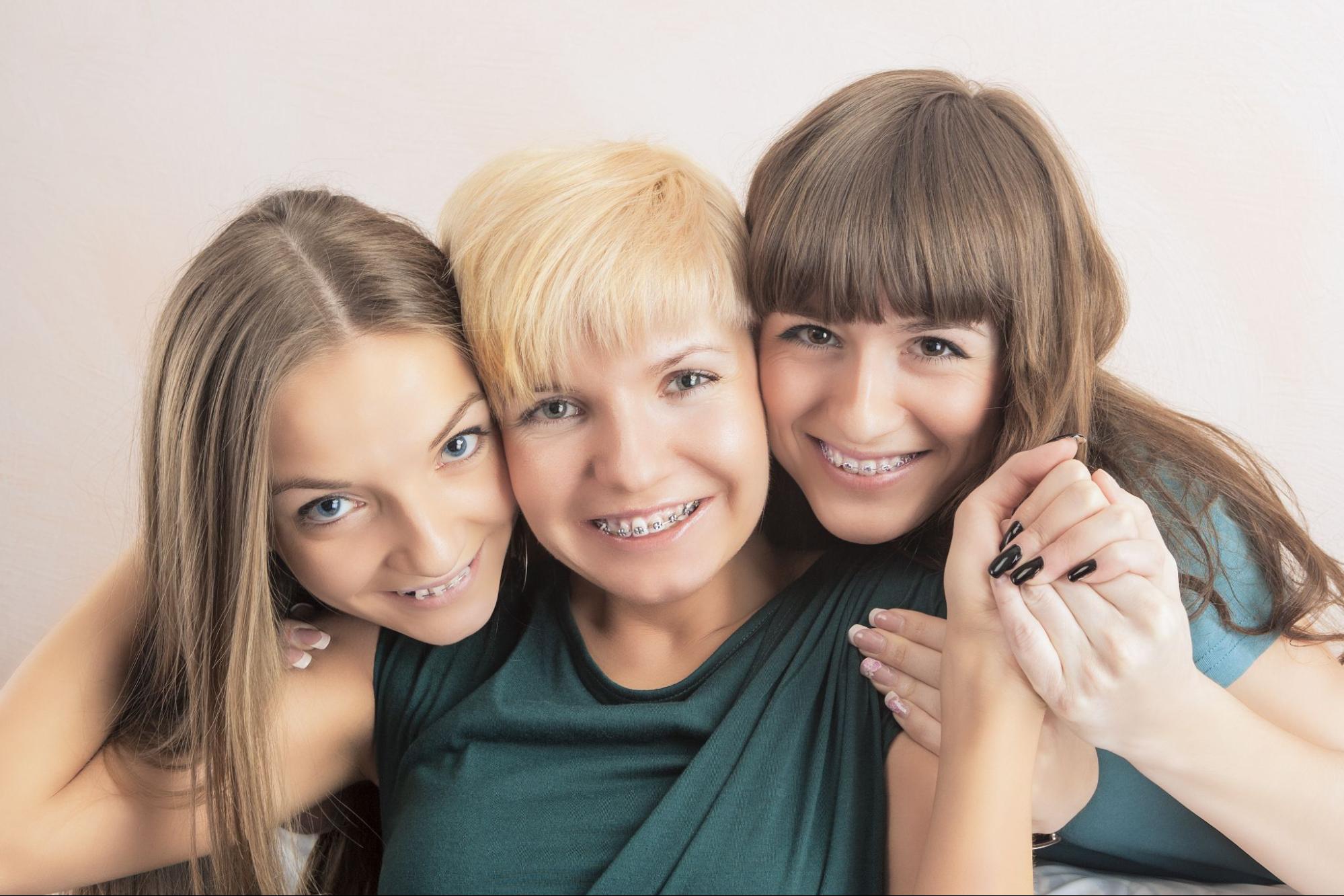 Adult women with braces.