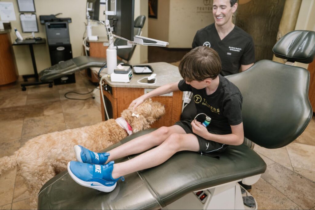 A Glendale patient petting a dog.